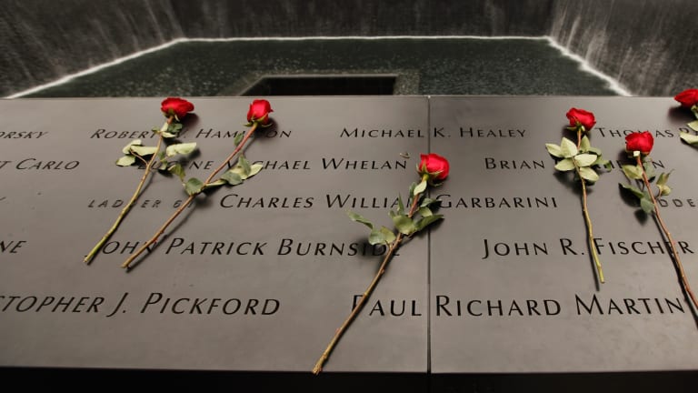 Picture of roses laid on the 9/11 Memorial
